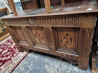 Lot 1063 - An 18th-century oak panel front coffer with...