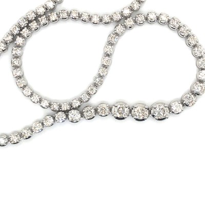 Lot 129 - A 9ct hallmarked white gold graduated round...