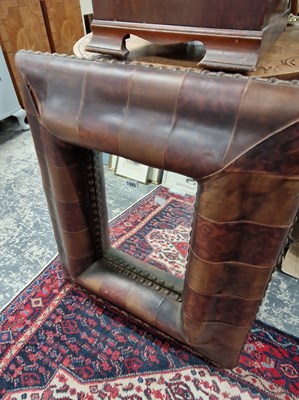 Lot 1085 - A leather framed mirror