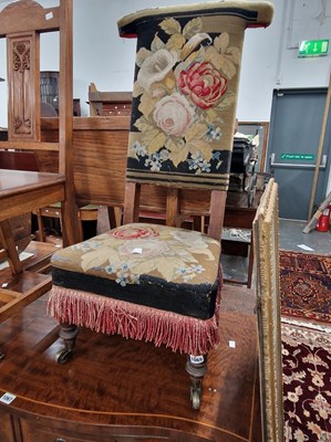 Lot 1065 - A Victorian needlepoint upholstered prie dieu...