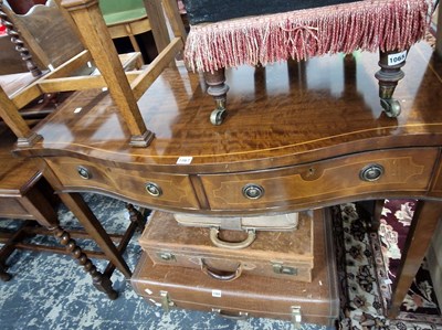 Lot 1067 - A Georgian style serpentine side table