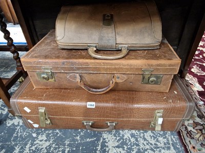 Lot 1068 - A leather suitcase, a briefcase and one other...