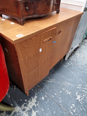 Lot 1112 - A retro teak sewing cabinet with a singer...