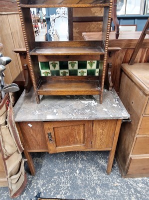 Lot 1121 - An Edwardian marble top, tile back washstand...