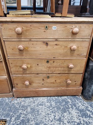 Lot 1124 - A late Georgian pine chest of four graduated...