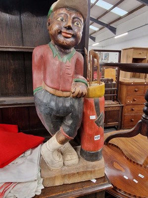Lot 1127 - A carved and painted figure of a golfer. 34 cm...