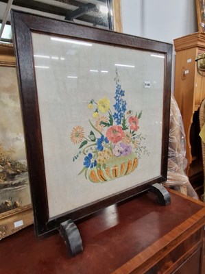 Lot 1148 - An embroidered firescreen.