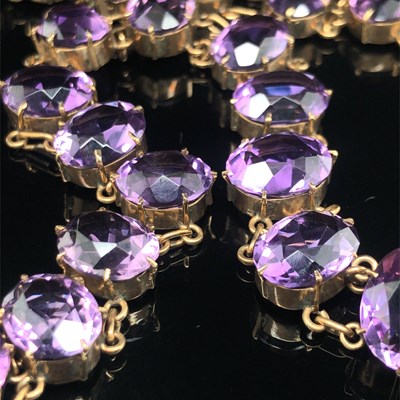 Lot 52 - An antique amethyst Riviere necklace. Each...