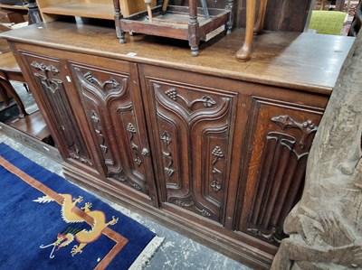 Lot 1161 - A large antique oak side cabinet with two...