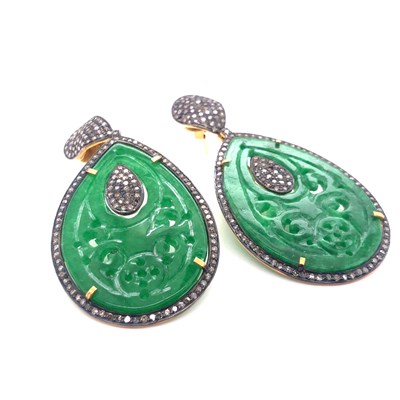 Lot 58 - A pair of carved green jade and multi-diamond...