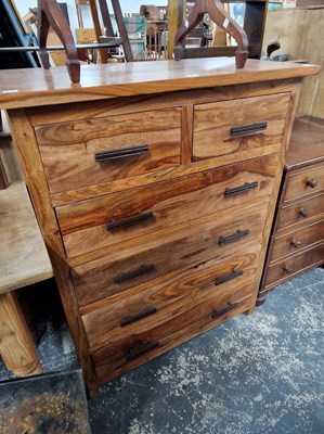 Lot 1169 - A modern hardwood chest of drawers.