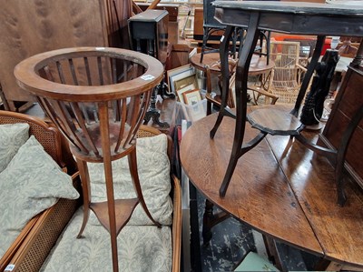 Lot 1196 - An Edwardian mahogany plant stand and a shaped...
