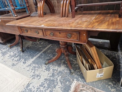 Lot 1206 - A Georgian mahogany sofa table with drop leaf...