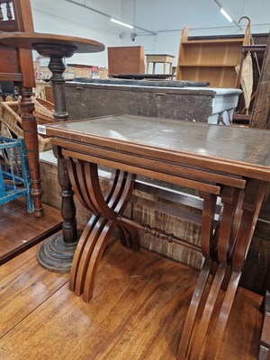 Lot 1207 - A nest of mahogany tables and a plant stand.