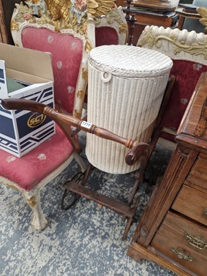 Lot 1210 - An antique wooden push chair and a lloyd loom...