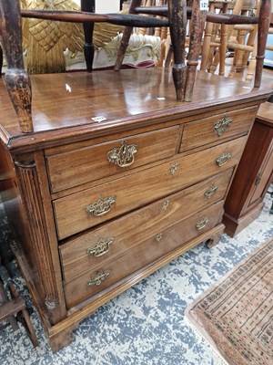 Lot 1212 - A Georgian mahogany chest of two short and...