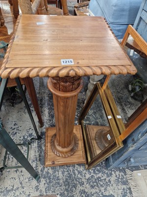 Lot 1215 - A carved hardwood plant stand.