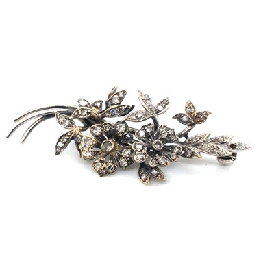 Lot 84 - A vintage 9ct diamond set floral brooch,...