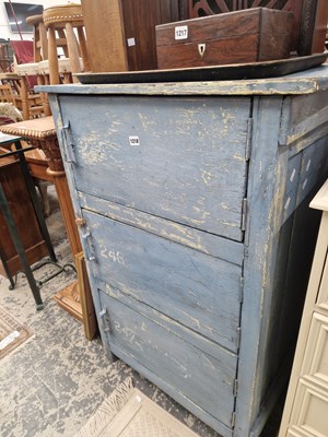 Lot 1218 - A painted rustic locker cabinet with three doors.
