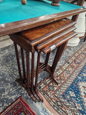 Lot 1238 - A next of three burr walnut occasional tables.