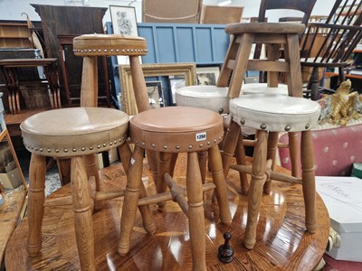 Lot 1250 - a set of five oak stools with upholstered top,...