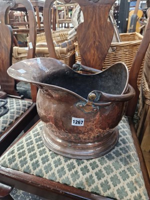 Lot 1267 - An antique copper coal scuttle.