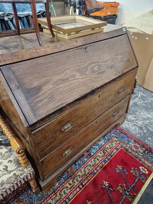 Lot 1276 - An 18th century oak and elm bureau.