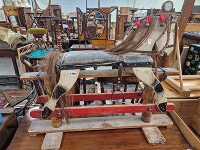 Lot 1285 - A vintage painted rocking horse.