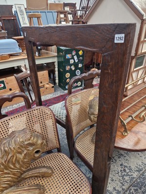 Lot 1292 - A large wall mirror in rustic oak frame.