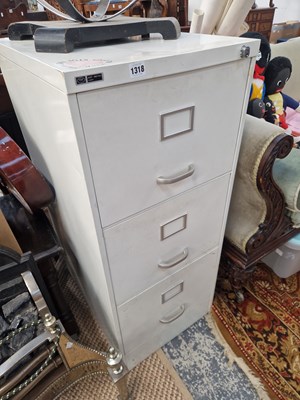 Lot 1318 - A three drawer filing cabinet.