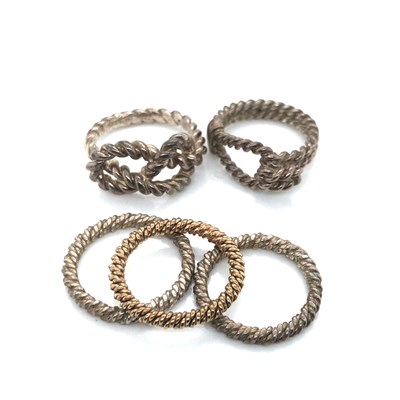 Lot 128 - A set of three stacking rings, unhallmarked,...