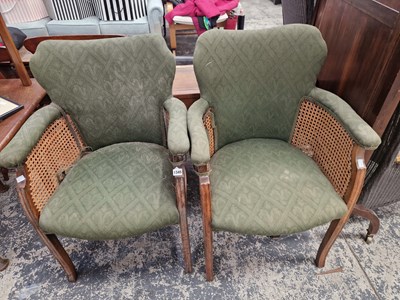 Lot 1345 - A pair of vintage bergere armchairs.