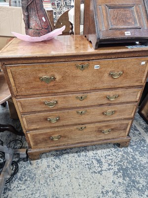 Lot 1349 - A George III oak and inlaid secretaire chest...