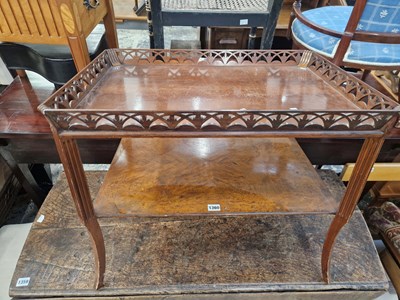 Lot 1360 - An antique walnut two tier gallery topped...