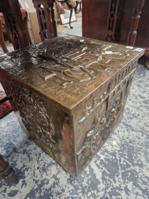 Lot 1381 - A large brass coal box with relief decoration.