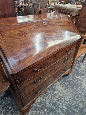 Lot 1382 - A George III mahogany bureau with fitted and...