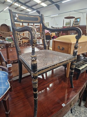 Lot 1386 - A Regency paint decorated cane seat armchair.
