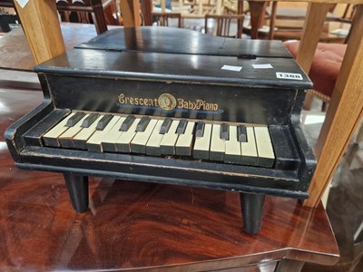 Lot 1388 - A mini piano.