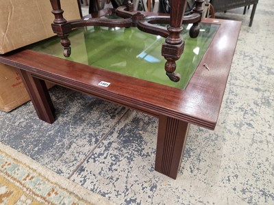 Lot 1401 - A glazed top bijouterie coffee table.