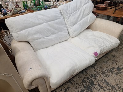 Lot 1405 - A modern white two seat sofa.