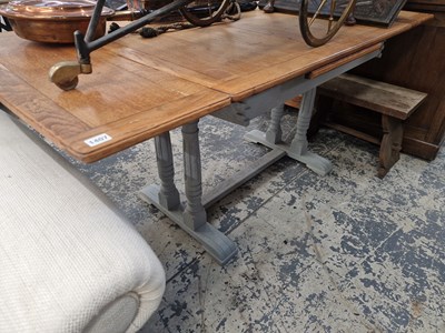 Lot 1407 - An oak extending dining table.
