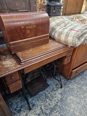 Lot 1411 - Two sewing machine , one on cast iron table...