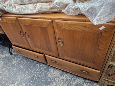 Lot 1412 - An ercol pale elm sideboard.