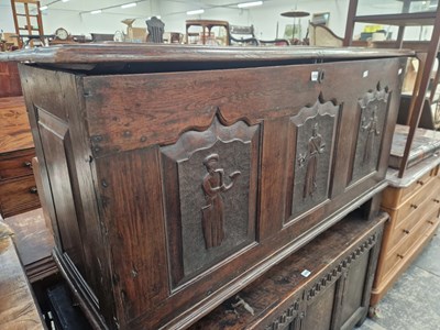 Lot 1418 - An 18th century oak coffer with triple panel...