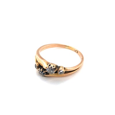 Lot 156 - A four-stone diamond dress ring, unhallmarked...