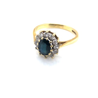 Lot 161 - An 18ct hallmarked gold sapphire and diamond...