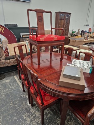 Lot 1436 - A large oriental hardwood dining table...