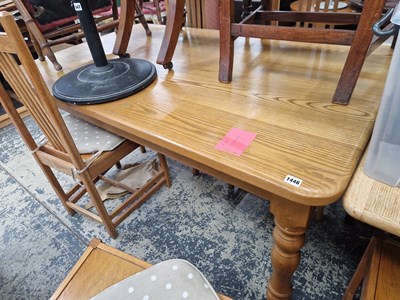 Lot 1446 - A heavy oak kitchen table on turned legs.
