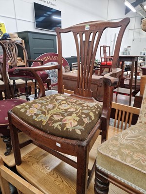 Lot 1450 - A large Georgian armchair with a deep dished...