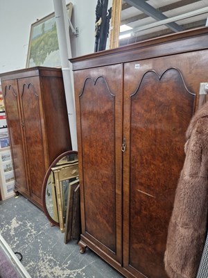 Lot 1452 - A pair of walnut veneer two door wardrobes. H...